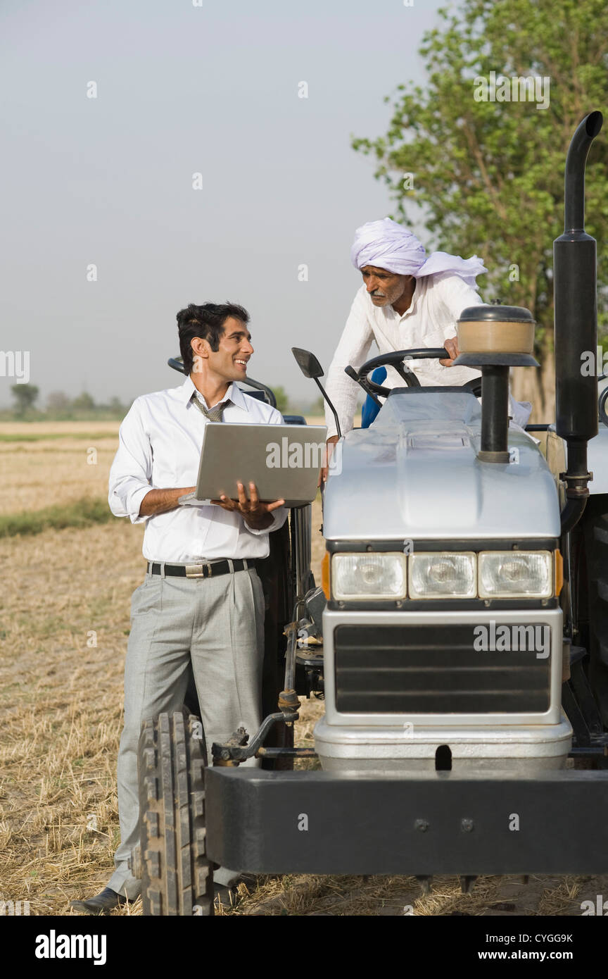 Indian farmer standing tractor field hi-res stock photography and ...