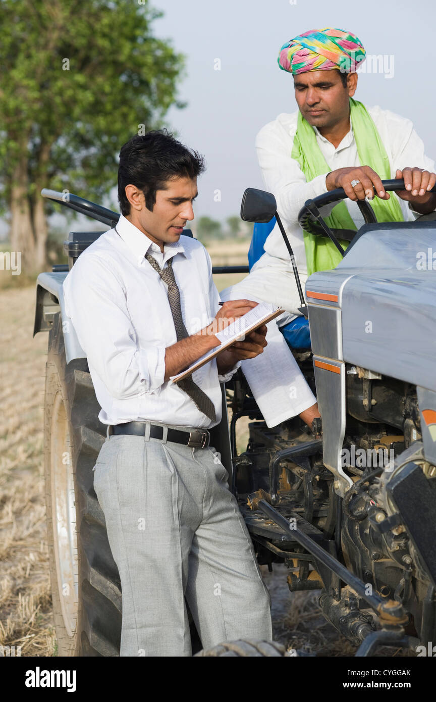 Indian farmer standing tractor field hi-res stock photography and ...