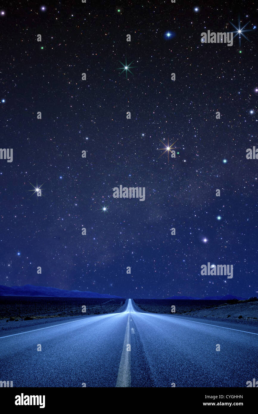 Road and stars in the night sky Stock Photo