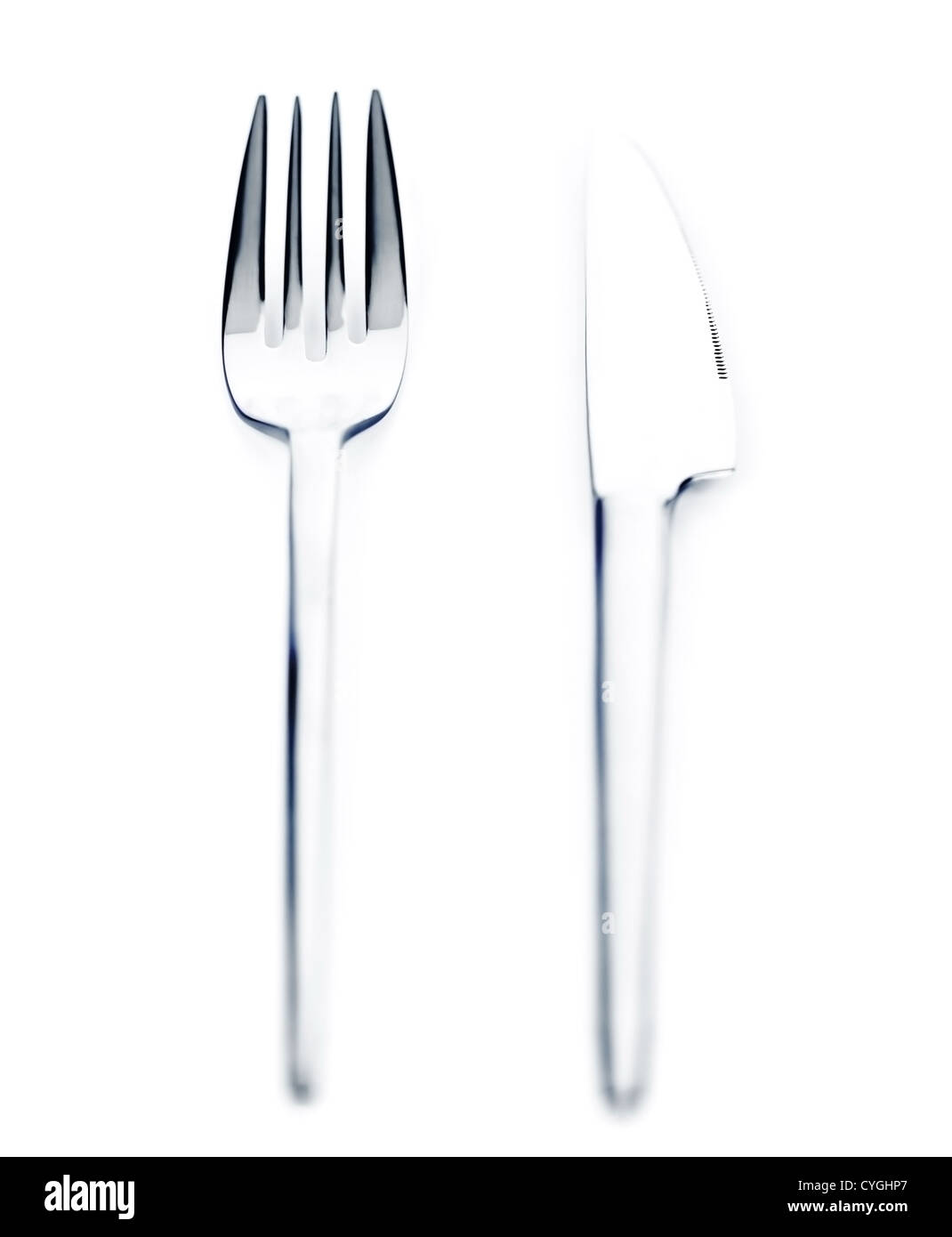 Photo of silver knife and fork isolated on white background, luxury