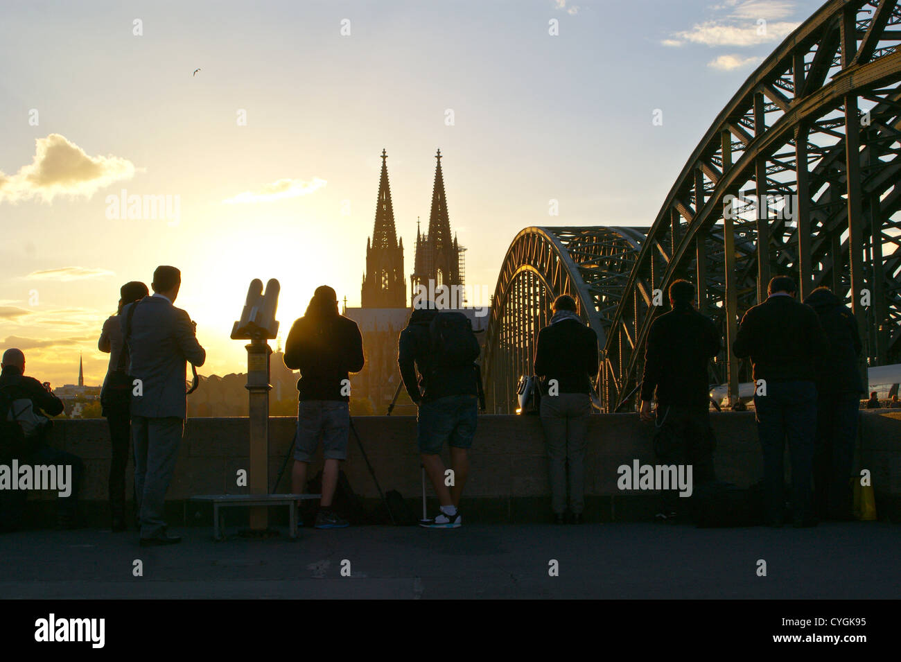 Photographers and Cologne cathedral, Koln, Nordrhein-Westfalen, Germany at sunset from Hohenzollern bridge Stock Photo