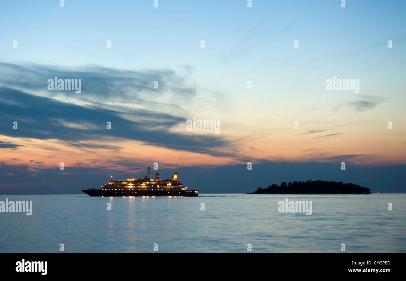 A cruise ship in the twilight in the adriatic sea for the coast of Croatia Stock Photo