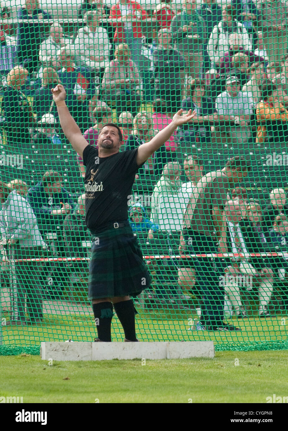 Man having thrown a hammer in the hammer throwing competition at Highland Games, Scotland Stock Photo
