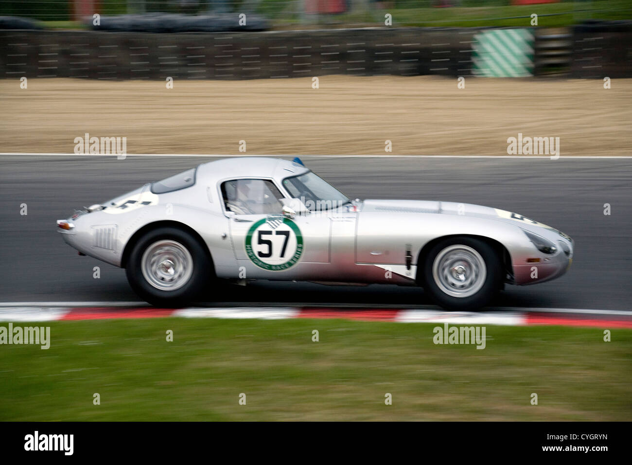 A hardtop E-type Jaguar racing at Brands Hatch racing circuit. Stock Photo