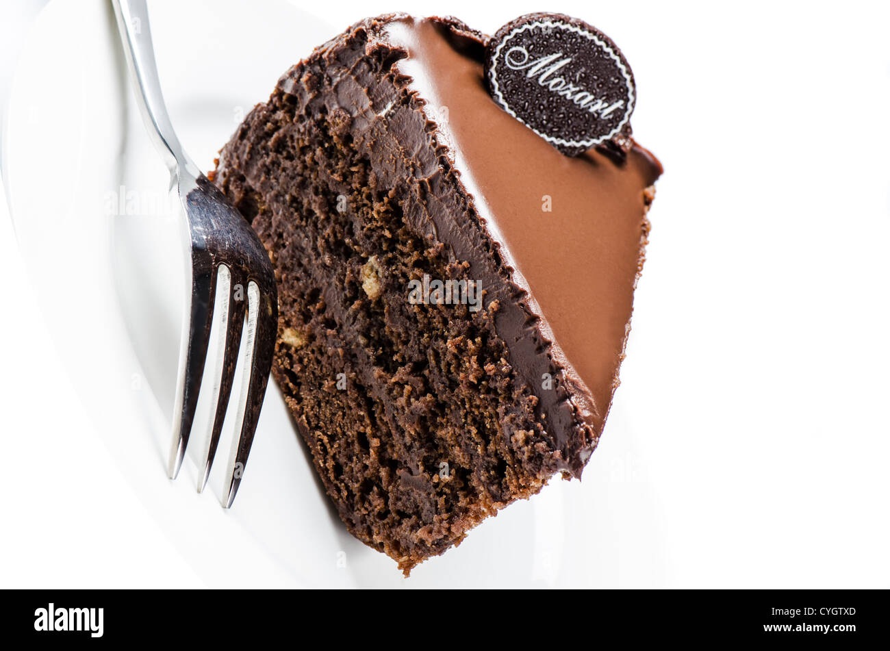 Piece of chocolate cake on white Stock Photo - Alamy
