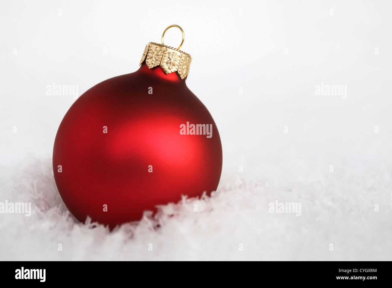 Red christmas ball in the snow hi-res stock photography and images - Alamy