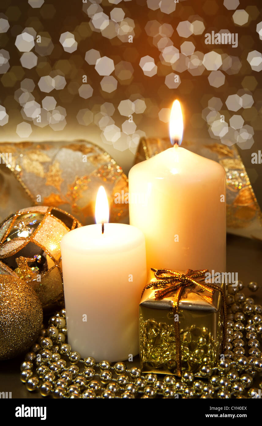 Christmas decoration with candles over dark background Stock Photo