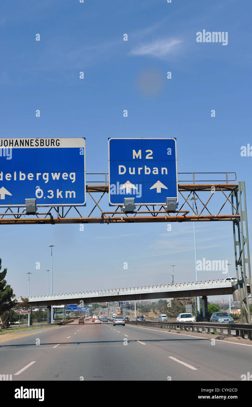 Driving on the M2 highway in Johannesburg passing a road sign to Durban