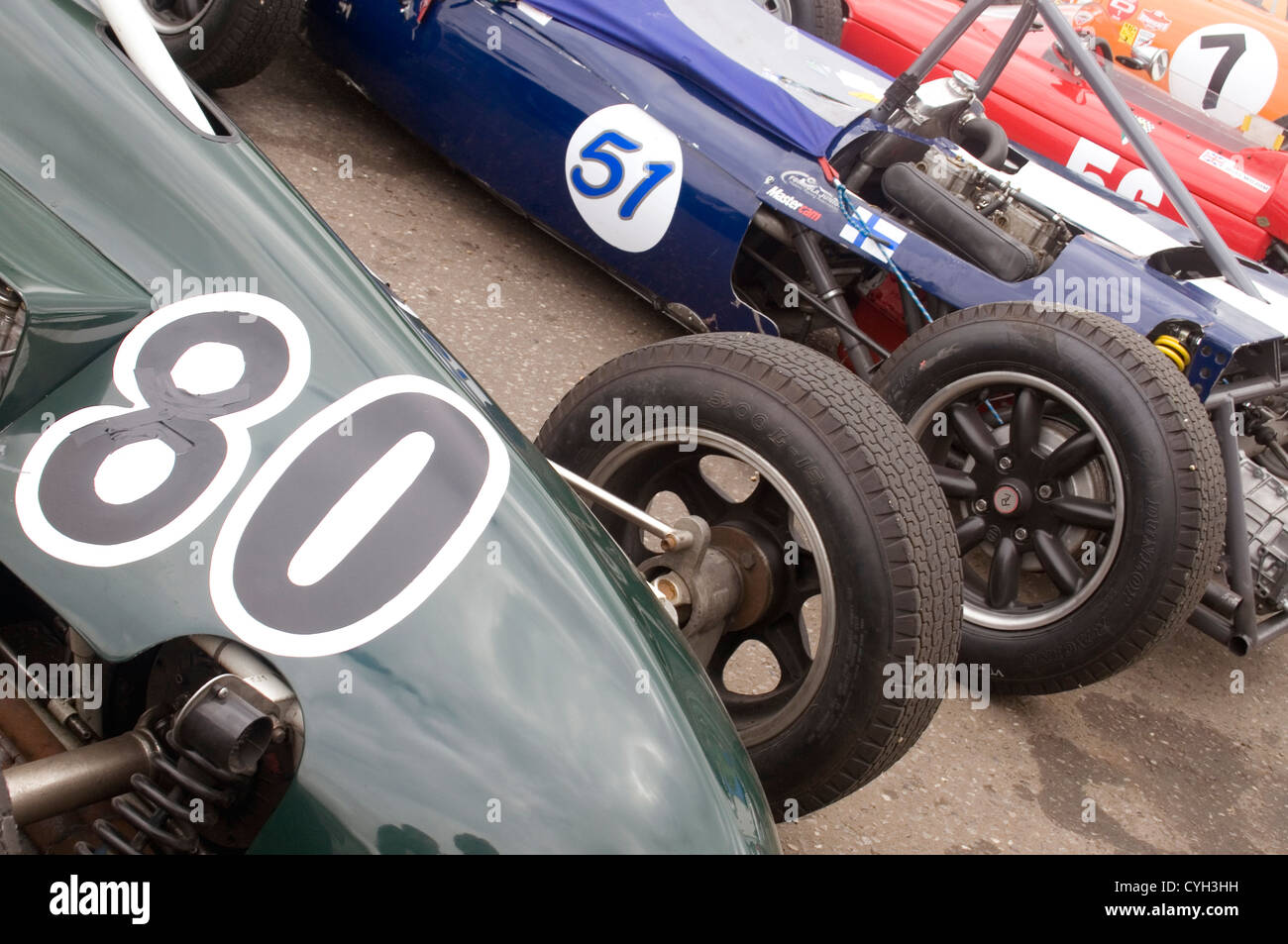 A line of racing cars being prepared before a race. Stock Photo