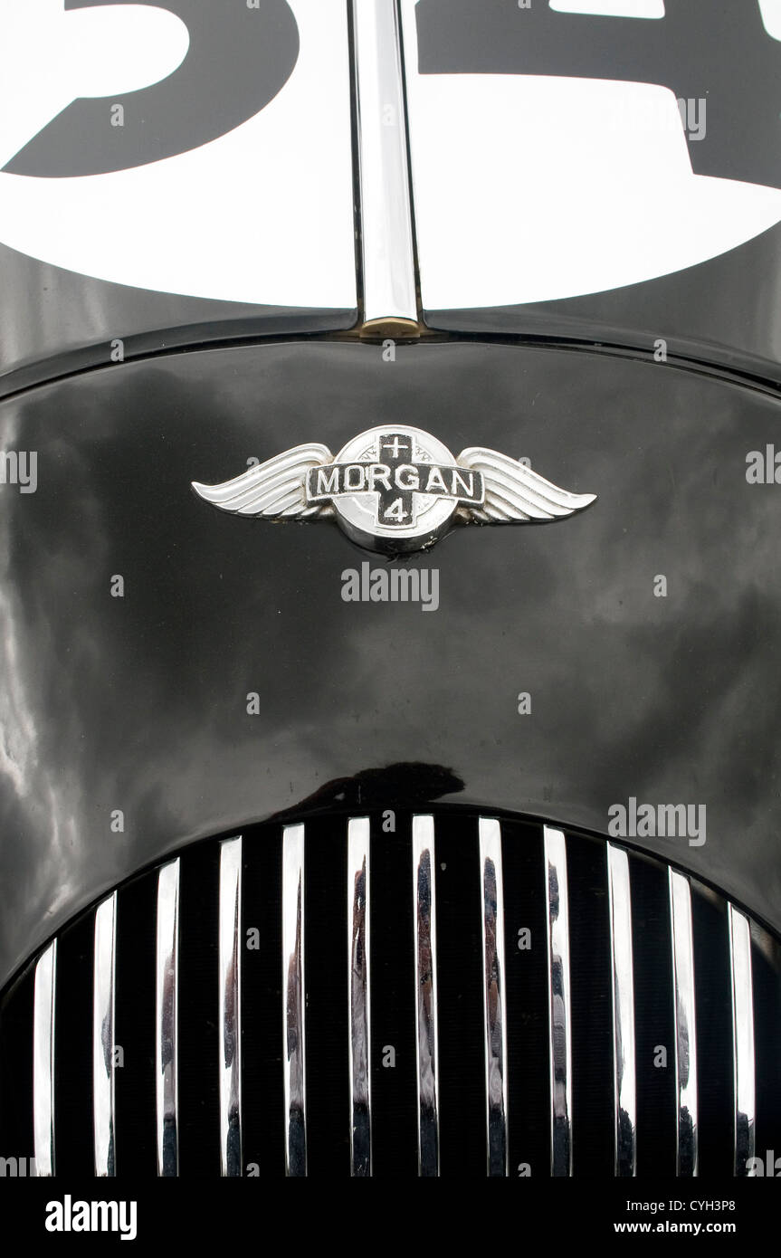 The nose and badge of a black Morgan +4 racing car. Stock Photo