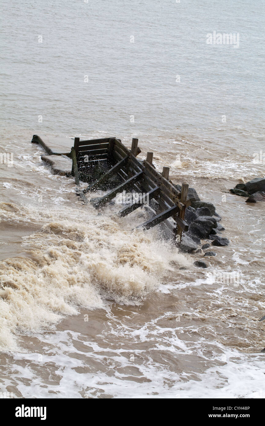 Timber Breakwater. Section at a critical point of major upheavel and displacement by strength and power of waves from North Sea. Stock Photo