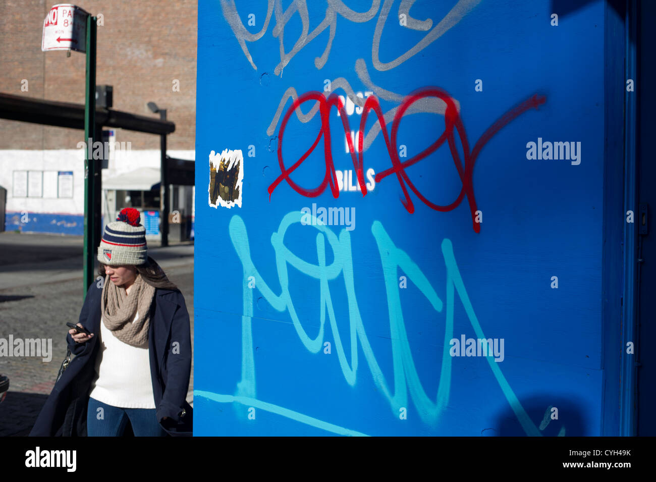 A wall covered with graffiti seen in the trendy Soho neighborhood of New York Stock Photo