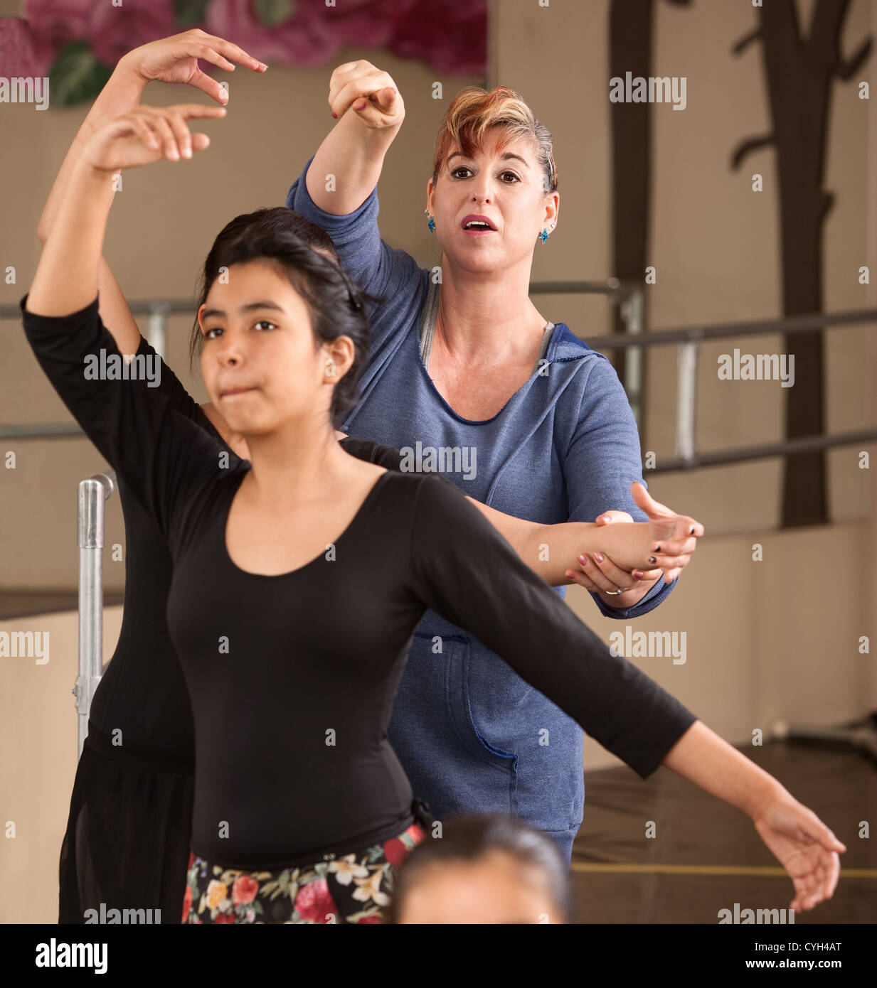 Ballet instructor directs students during dance practice Stock Photo