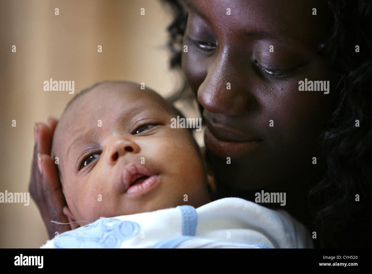 Mother (23) and her new born boy Joseph (1 month 20 days old), Dakar, Senegal Stock Photo