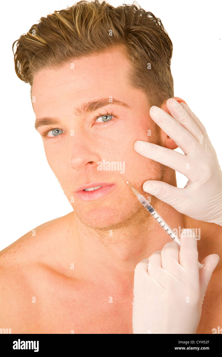 young man doing botox injections Stock Photo