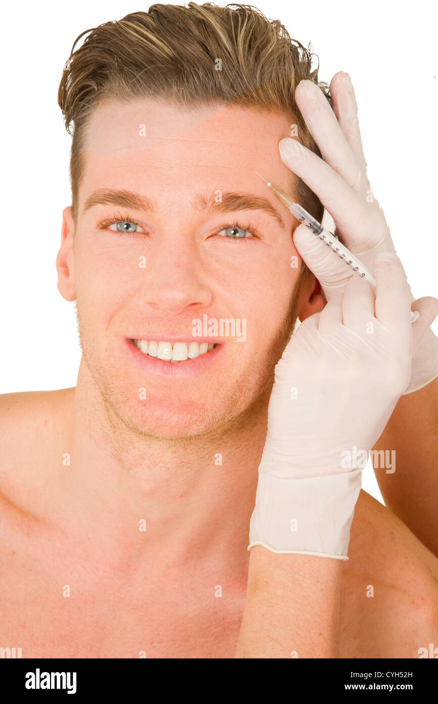 young man doing botox injections Stock Photo