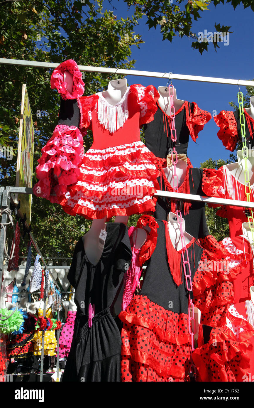 Souvenir Spanish flamenco dresses, accessories for sale El Rastro Sunday market, Madrid Stock Photo -