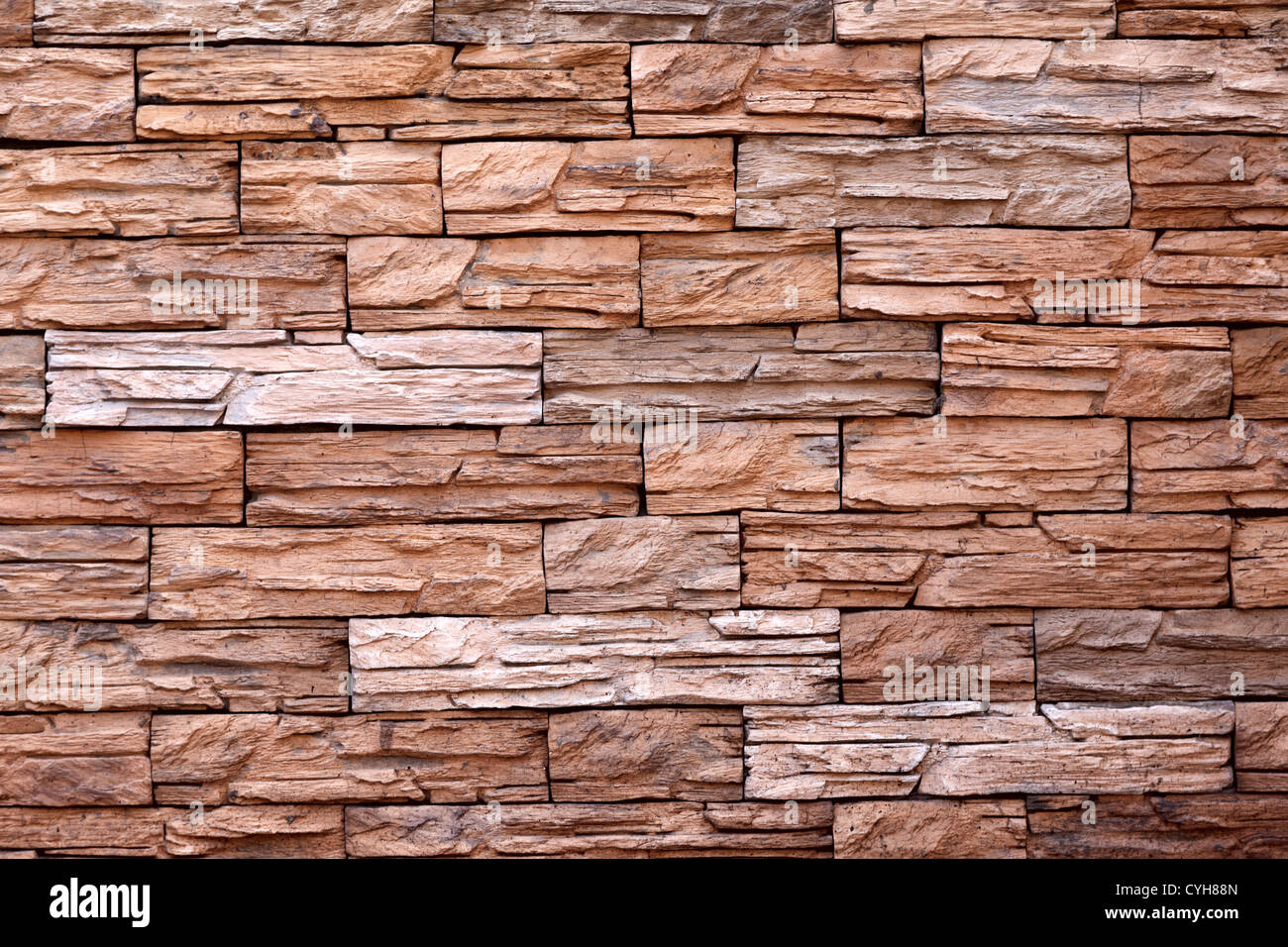 The texture of the red stone wall Stock Photo