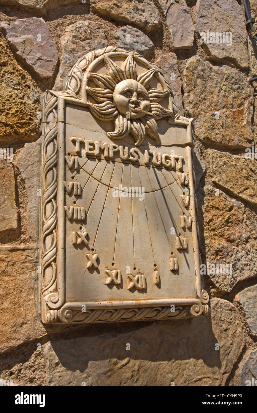 Sun dial on stone wall, Siurana, Catalunya, Spain Stock Photo