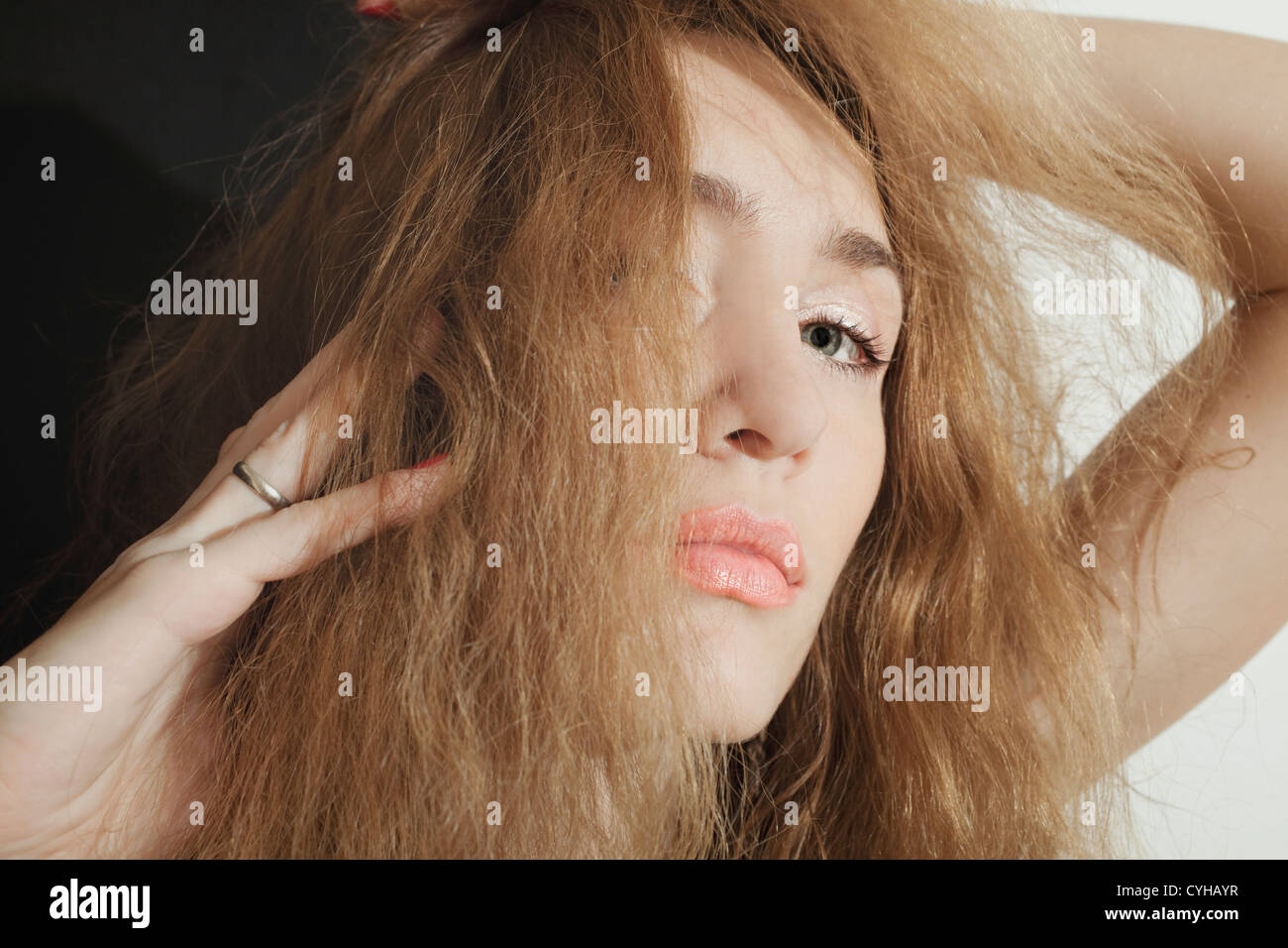 Portrait of a beautiful young woman with long curly hair Stock Photo ...