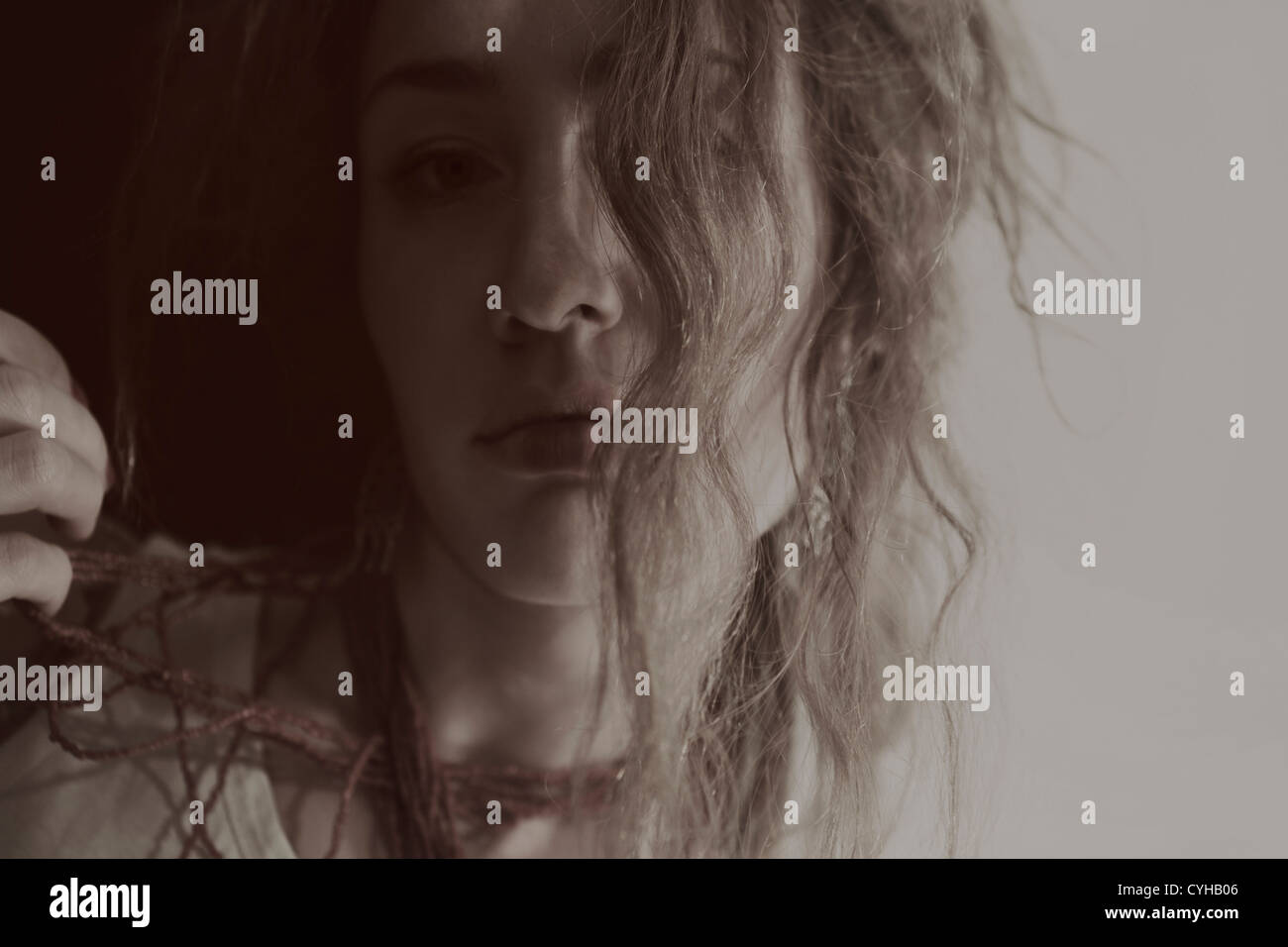 Portrait of a beautiful young woman with long curly hair Stock Photo ...