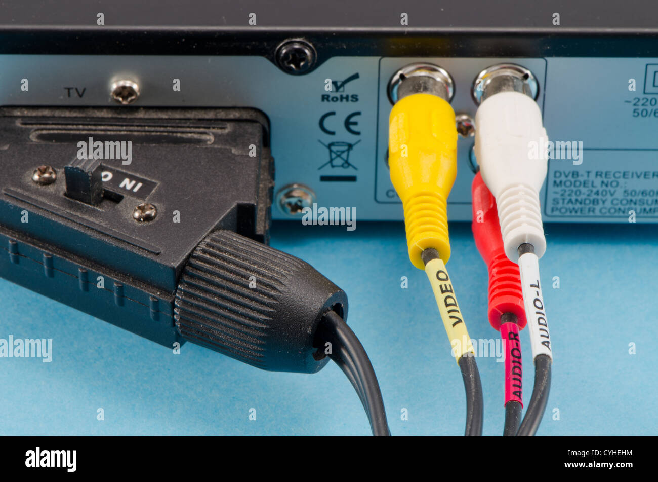 dvb-t tv receiver back side scart and tulip wires plugged in it. Stock Photo