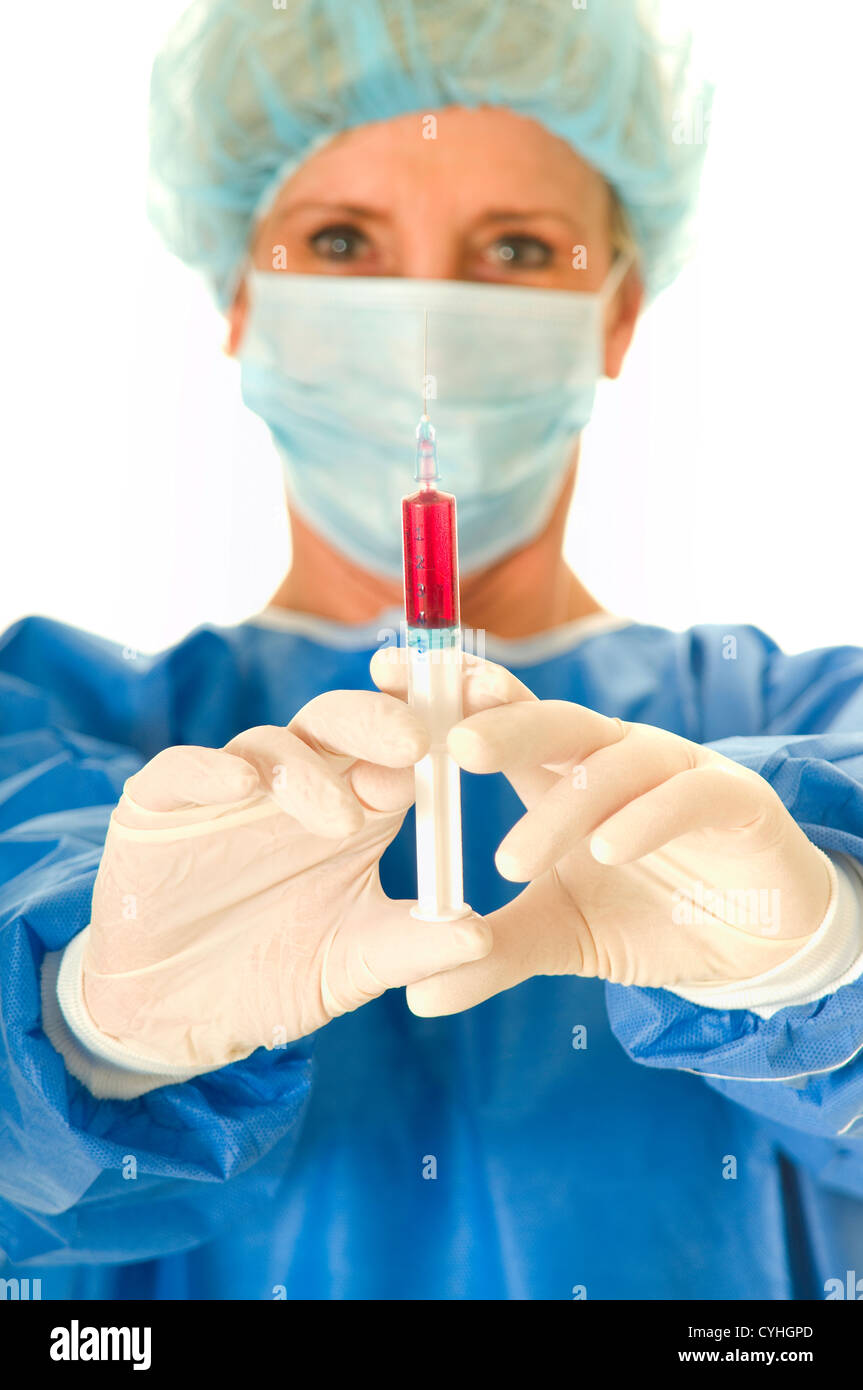 woman surgeon holding a syringe Stock Photo Alamy