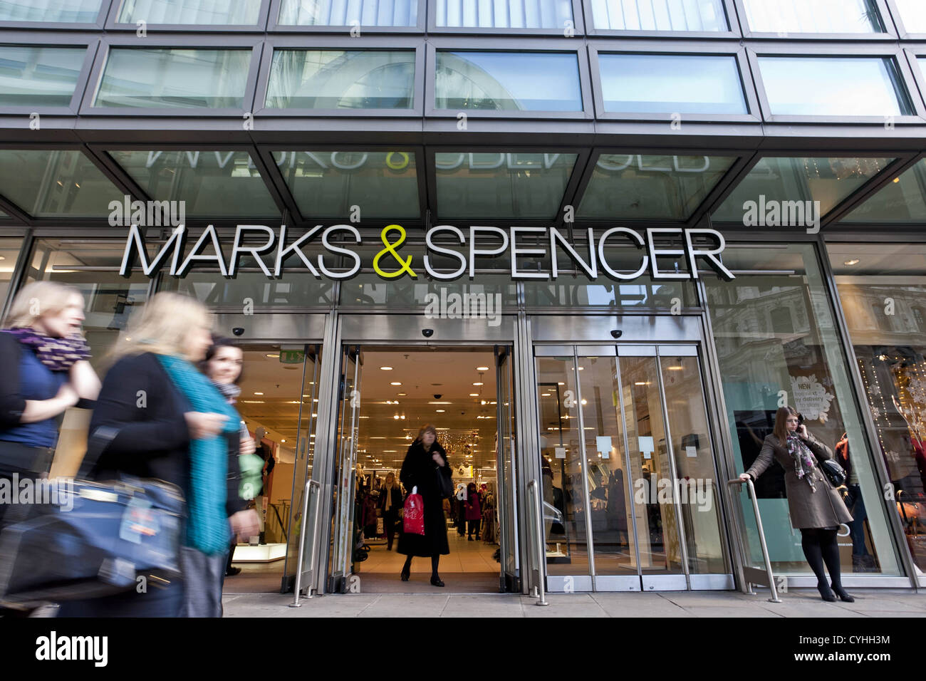 London, UK. 5/11/2012. (Pictured) People walking pass a Mark & Spencer store entrance in London ,Peter Barbe / Alamy Stock Photo