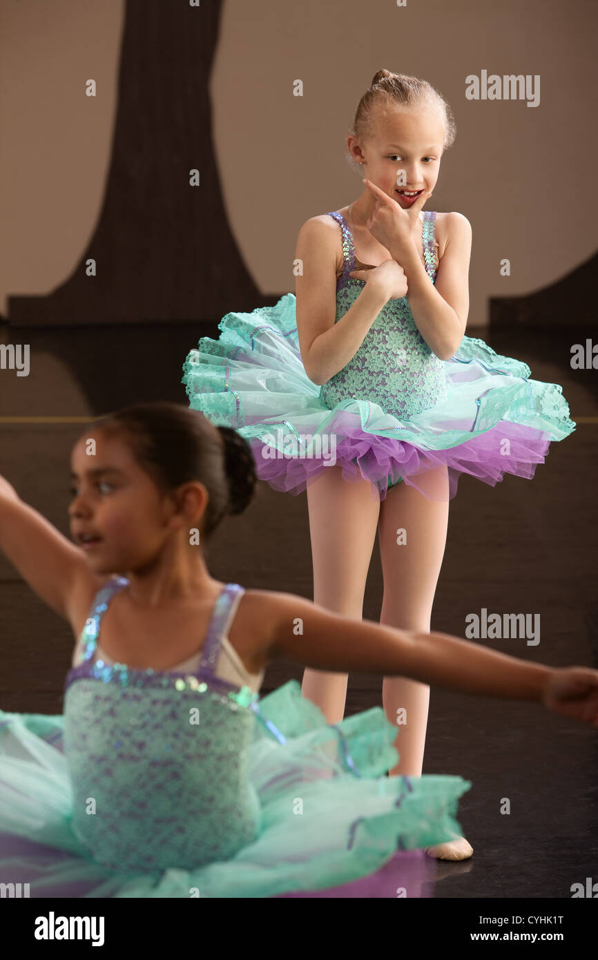 Two little girls in ballet dresses practice in a studio Stock Photo Alamy