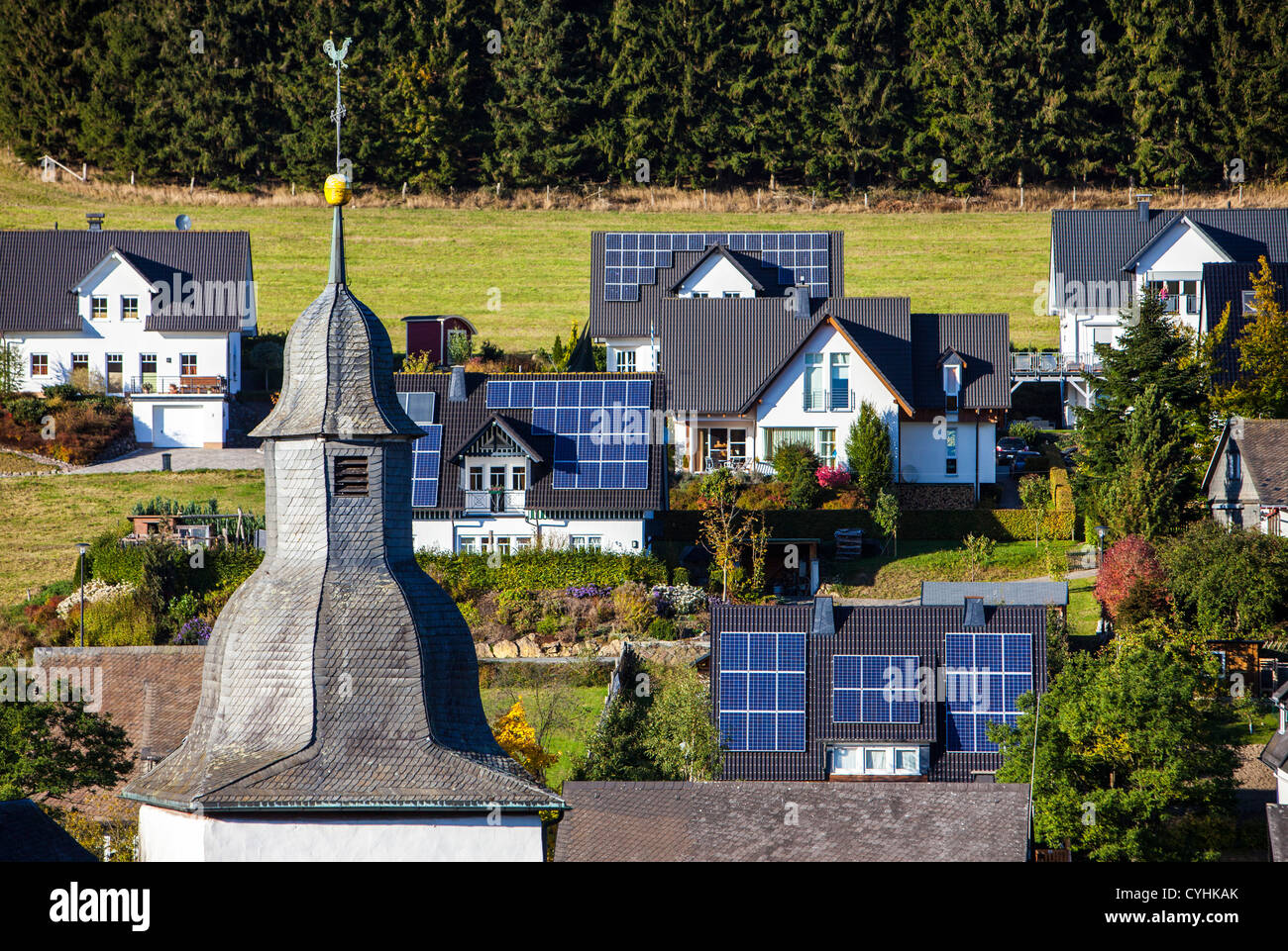 Solar panels on a roof of private houses. Solar thermal energy. Stock Photo