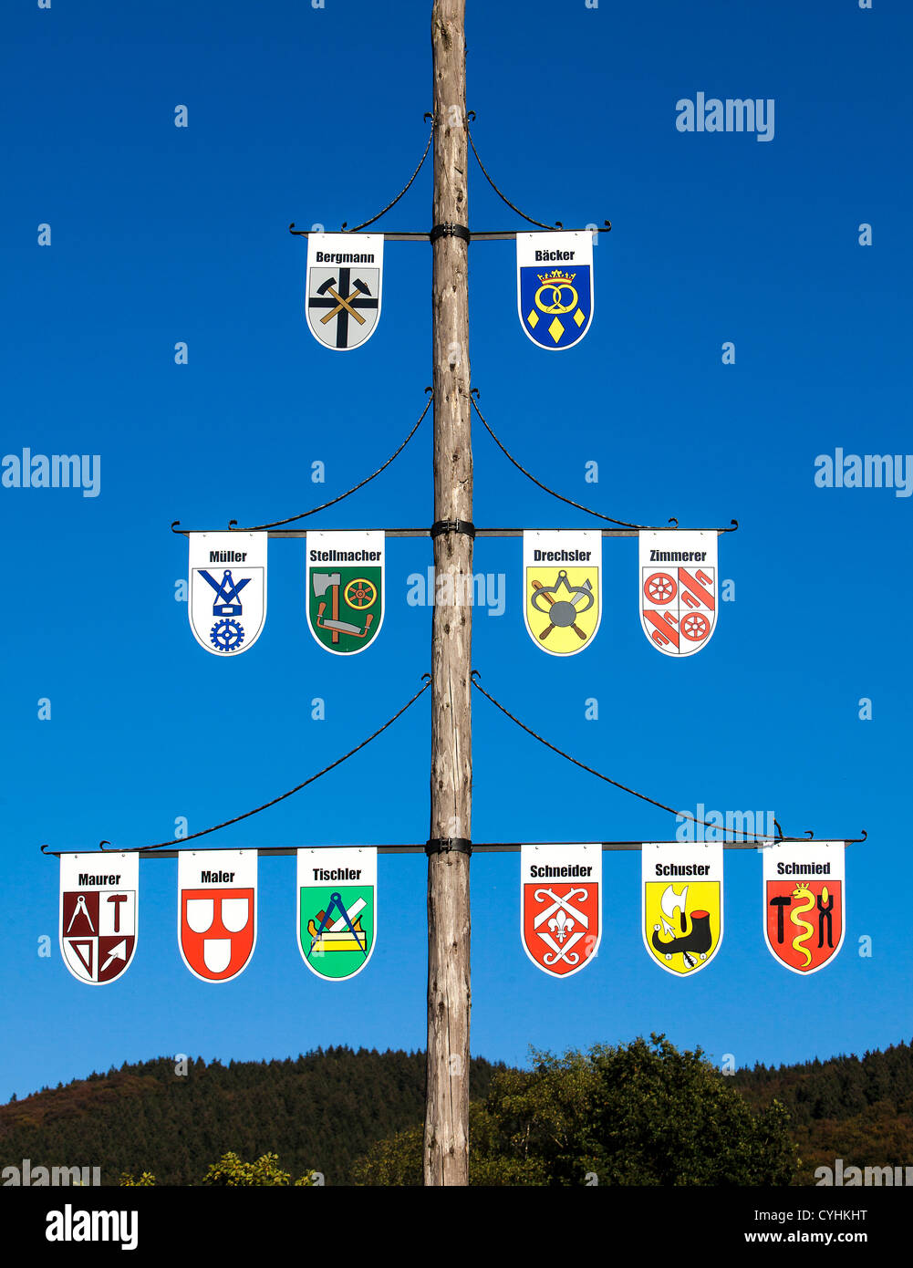 Coat tree, shows all coat of arms of any kind of craftsman in a village in the Sauerland area, north western Germany. Stock Photo