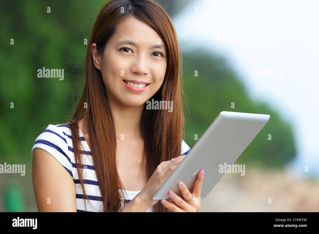 asian woman using tablet computer Stock Photo - Alamy