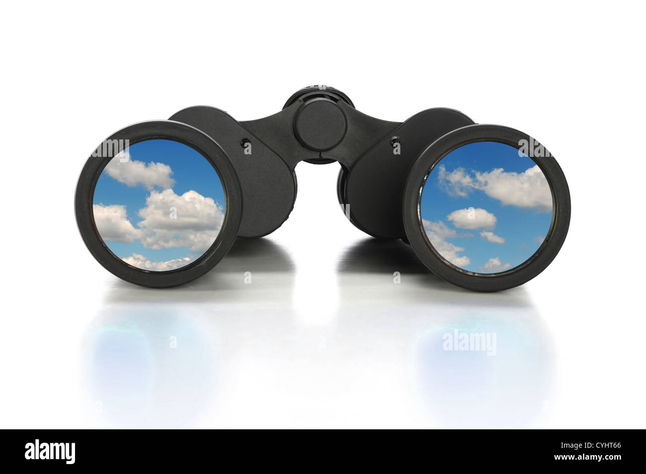 Binoculars with image of clouds over reflective table Stock Photo