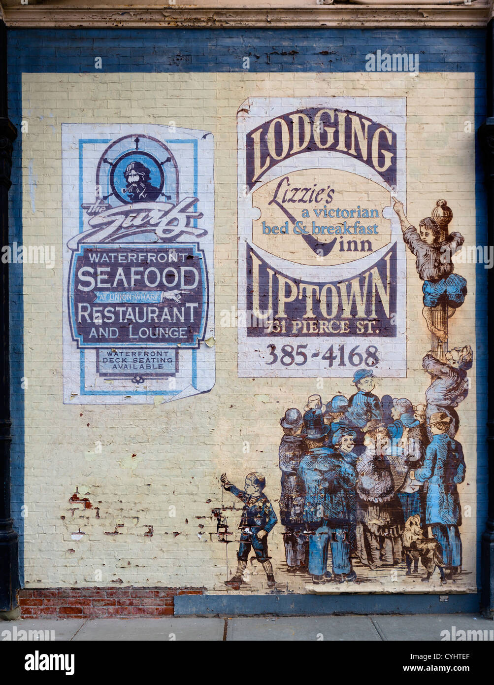 Mural advertising lodging and restaurant, Port Townsend, Olympic Peninsula, Washington, USA Stock Photo