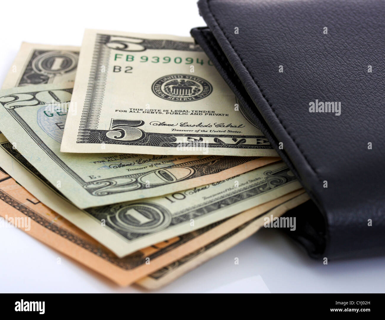 Several Dollar Bills Tucked In A Wallet Stock Photo