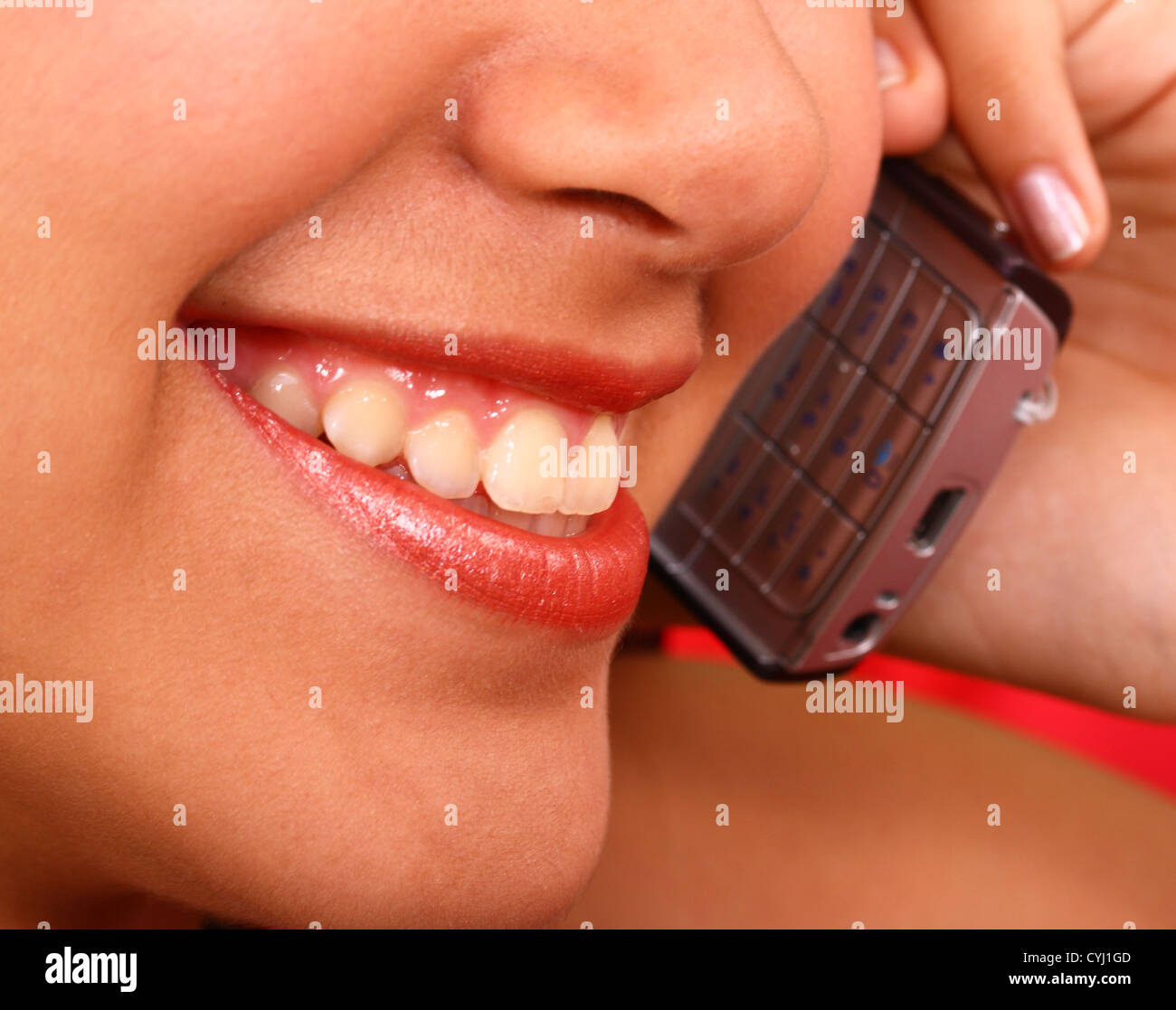 Happy Girl Making A Telephone Call To Her Friend Stock Photo