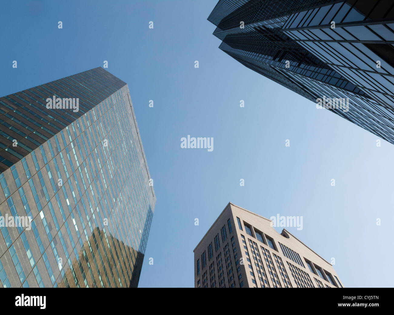 Towering Skyscrapers in Blue Sky, NYC Stock Photo