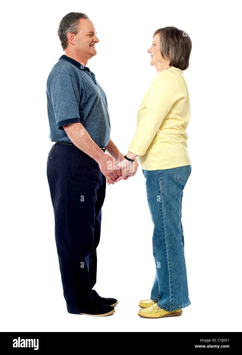 Full length portrait of happy old couple holding hands. Face to face Stock Photo