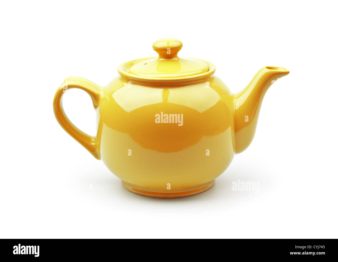 Bright orange teapot isolated on white background Stock Photo