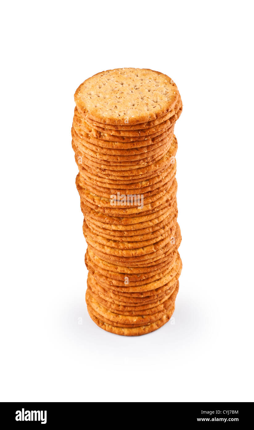 The high pile of delicious salty crackers isolated on white background Stock Photo