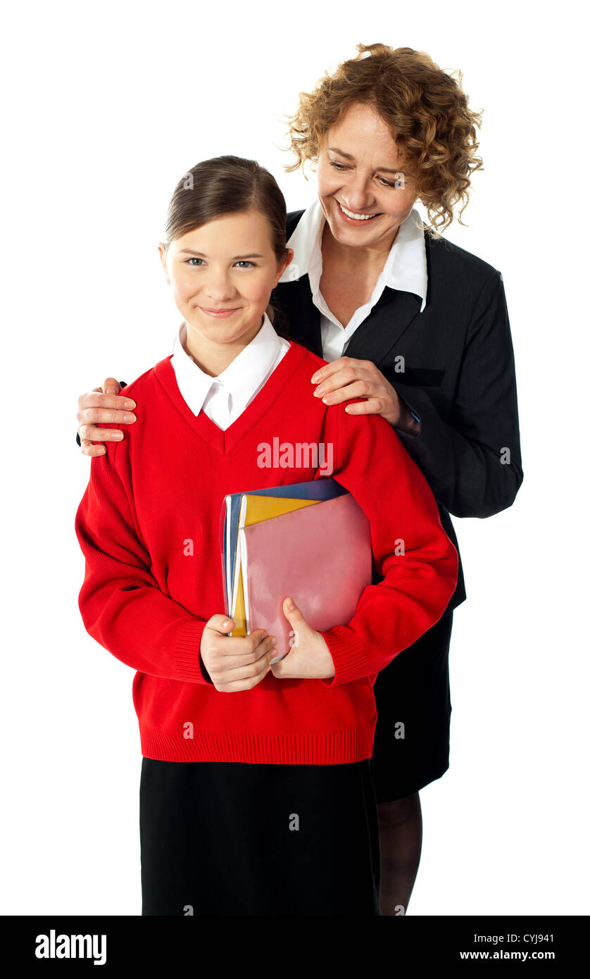 Teacher with teen student posing against white background, studio shot Stock Photo
