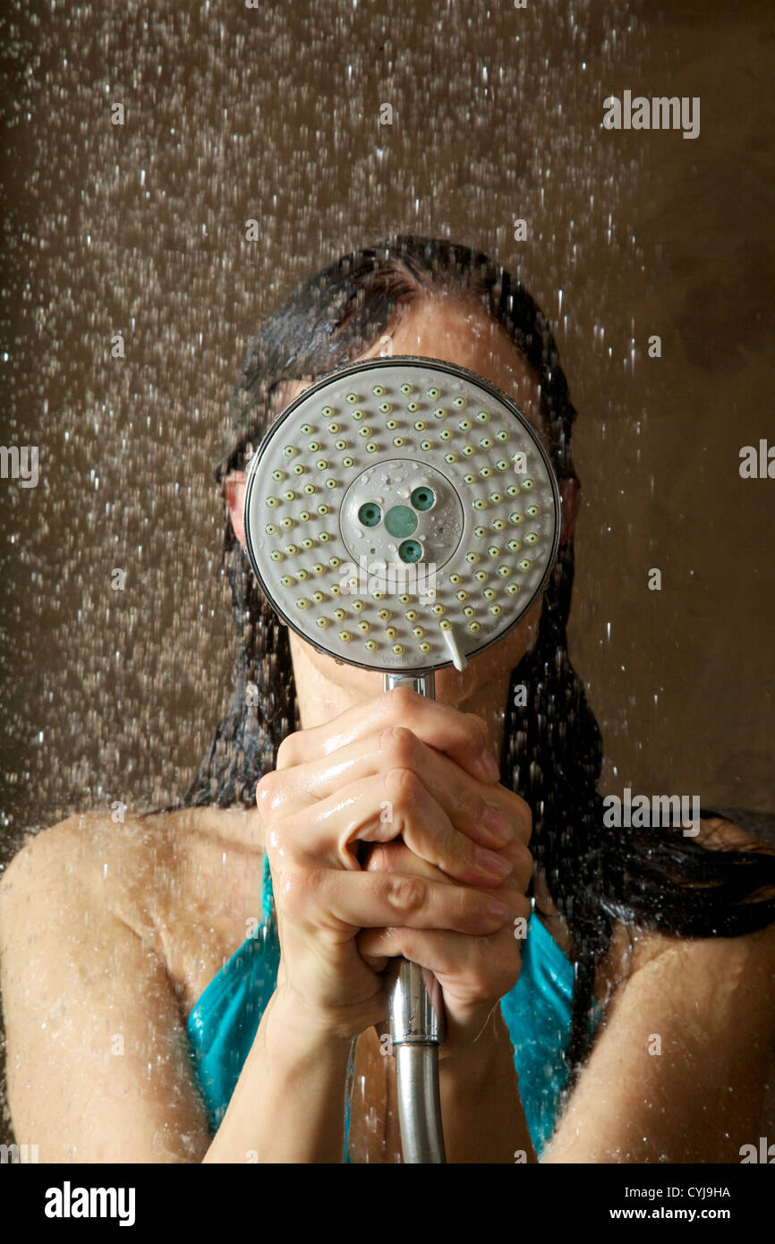 woman taking a shower under water jet Stock Photo Alamy