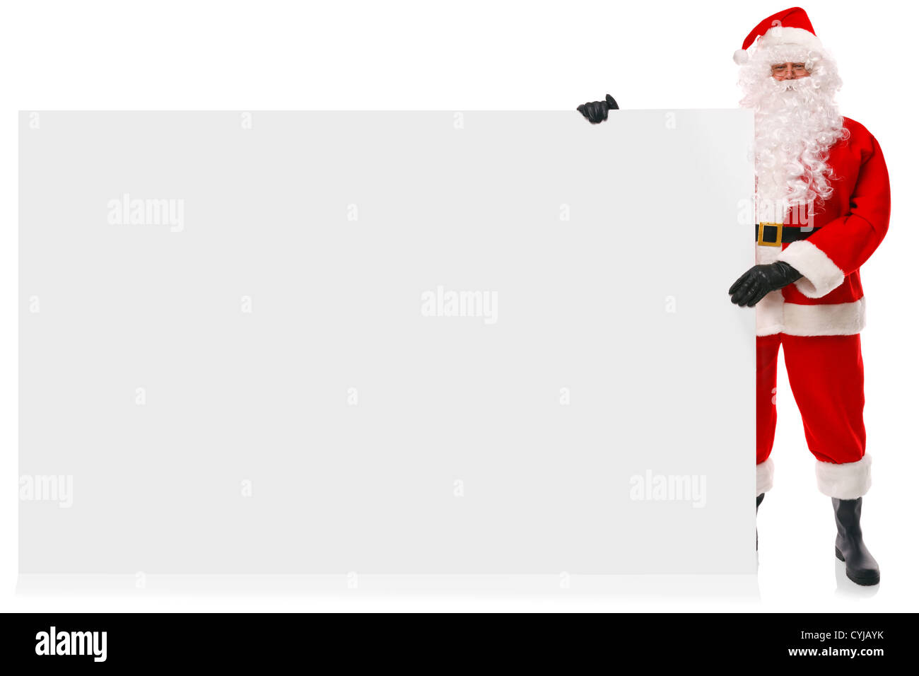 Full length photo of Santa Claus holding a large blank sign Stock Photo