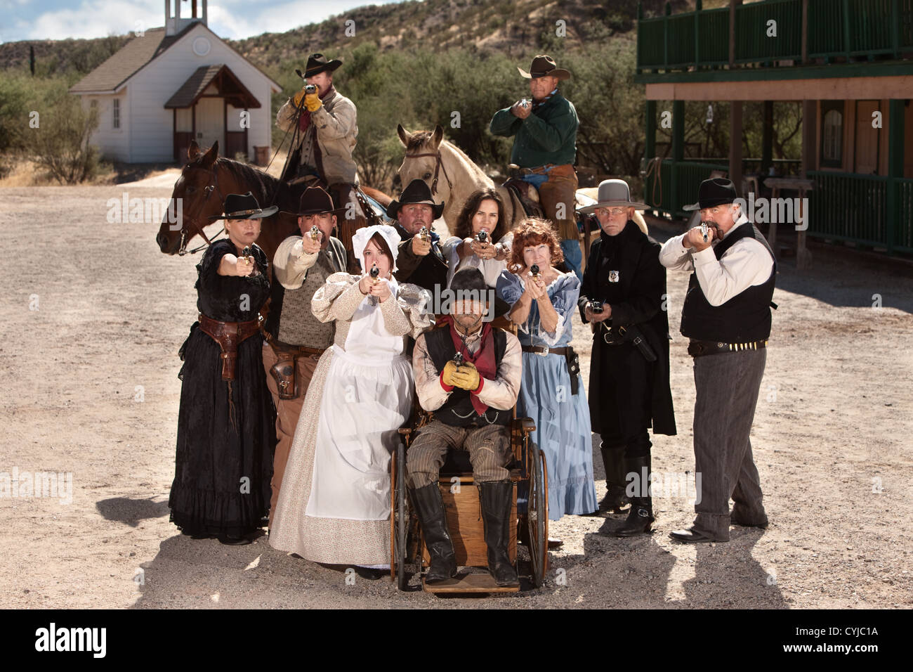Group of old American west townspeople with weapons Stock Photo