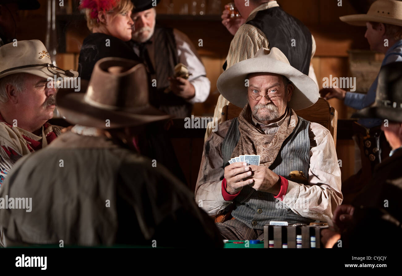 Man with poker face in American old west scene Stock Photo