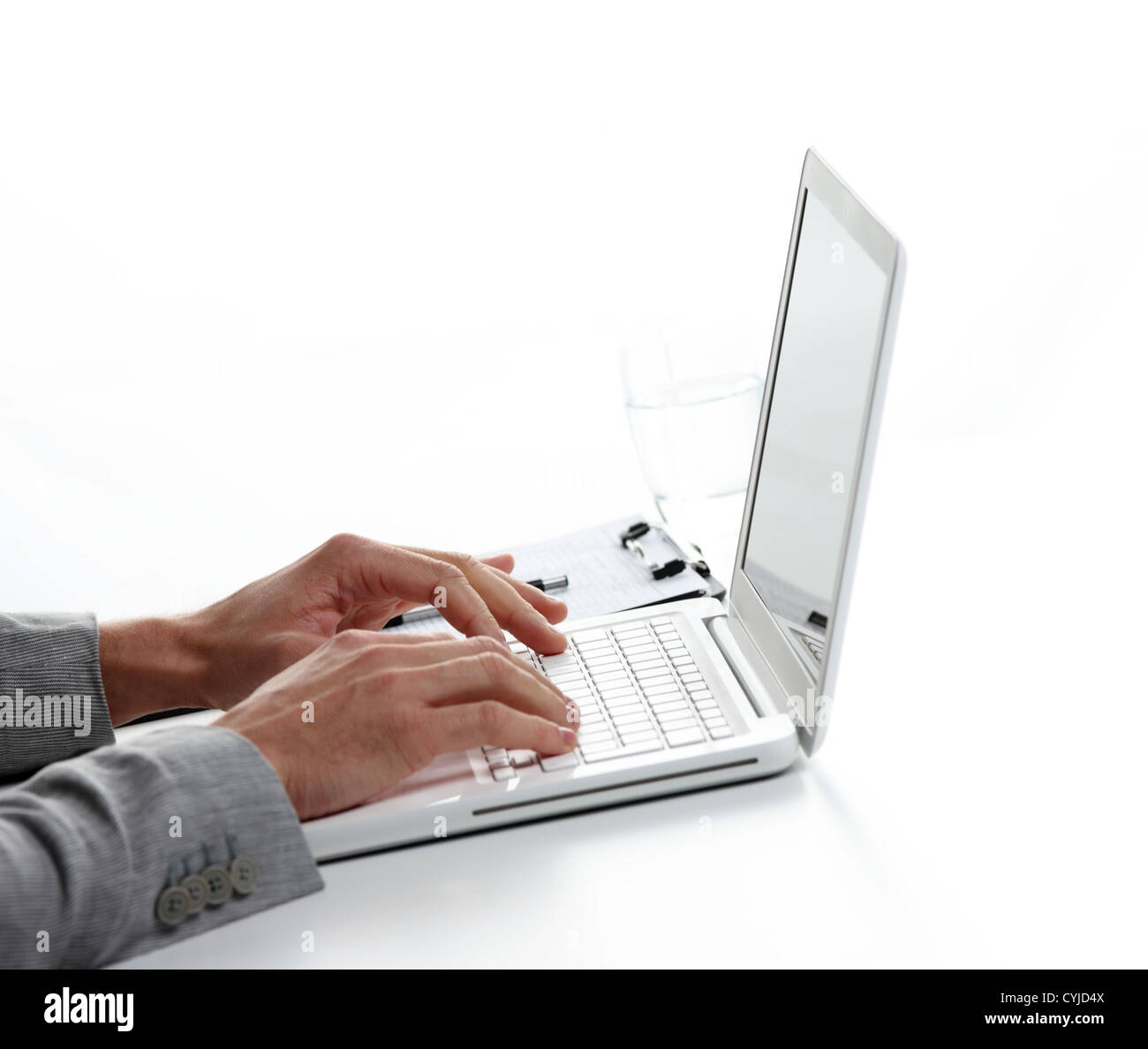 Businessman working at laptop computer, white background Stock Photo ...
