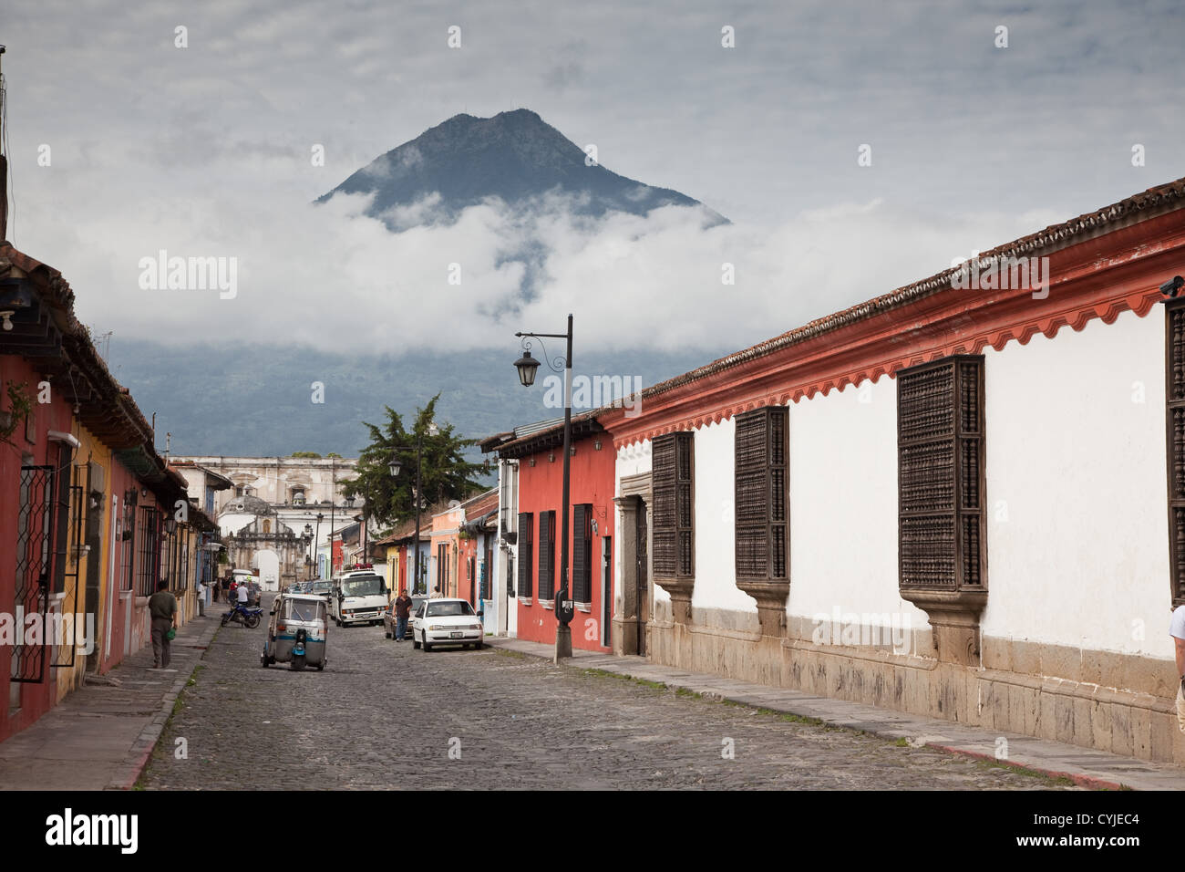 Classic view of World Heritage Antigua with wonderful old architecture, cobblestone streets and volcano looms as a backdrop. Stock Photo