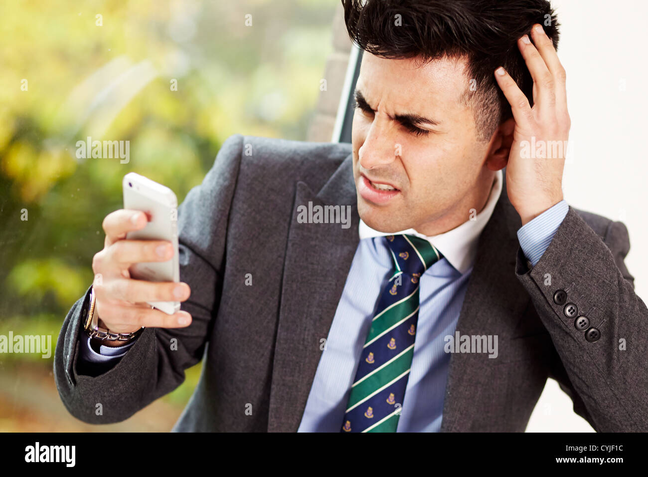 Man using iPhone 5 Stock Photo - Alamy