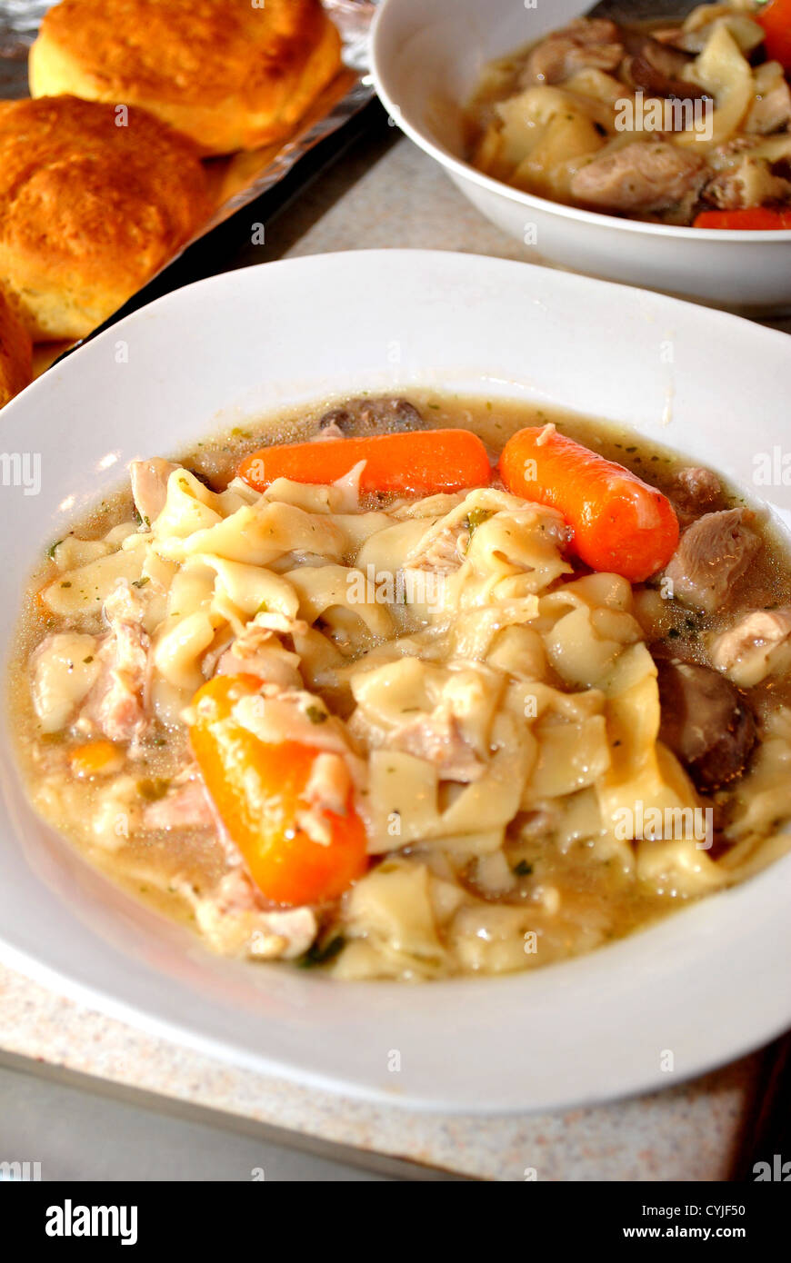 Homemade Chicken Noodle Soup with Biscuits Stock Photo Alamy