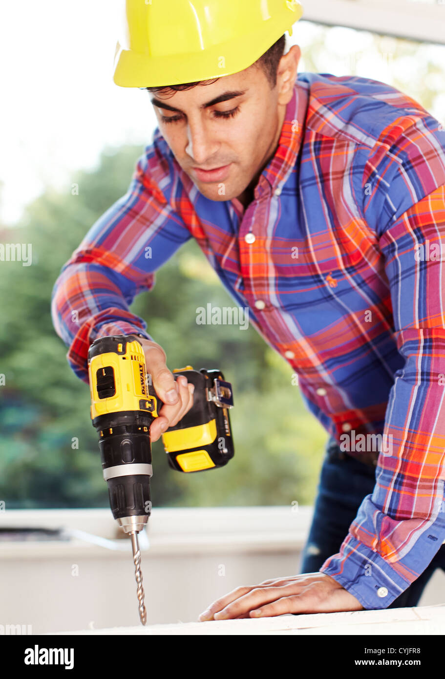 Man Holding Drill Stock Photo Alamy
